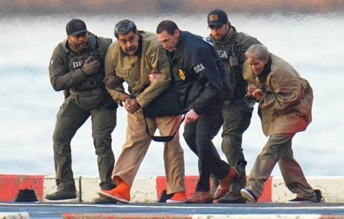 US federal agents escort Venezuelan president Nicolás Maduro and his wife, Cilia Flores, to detention in New York.