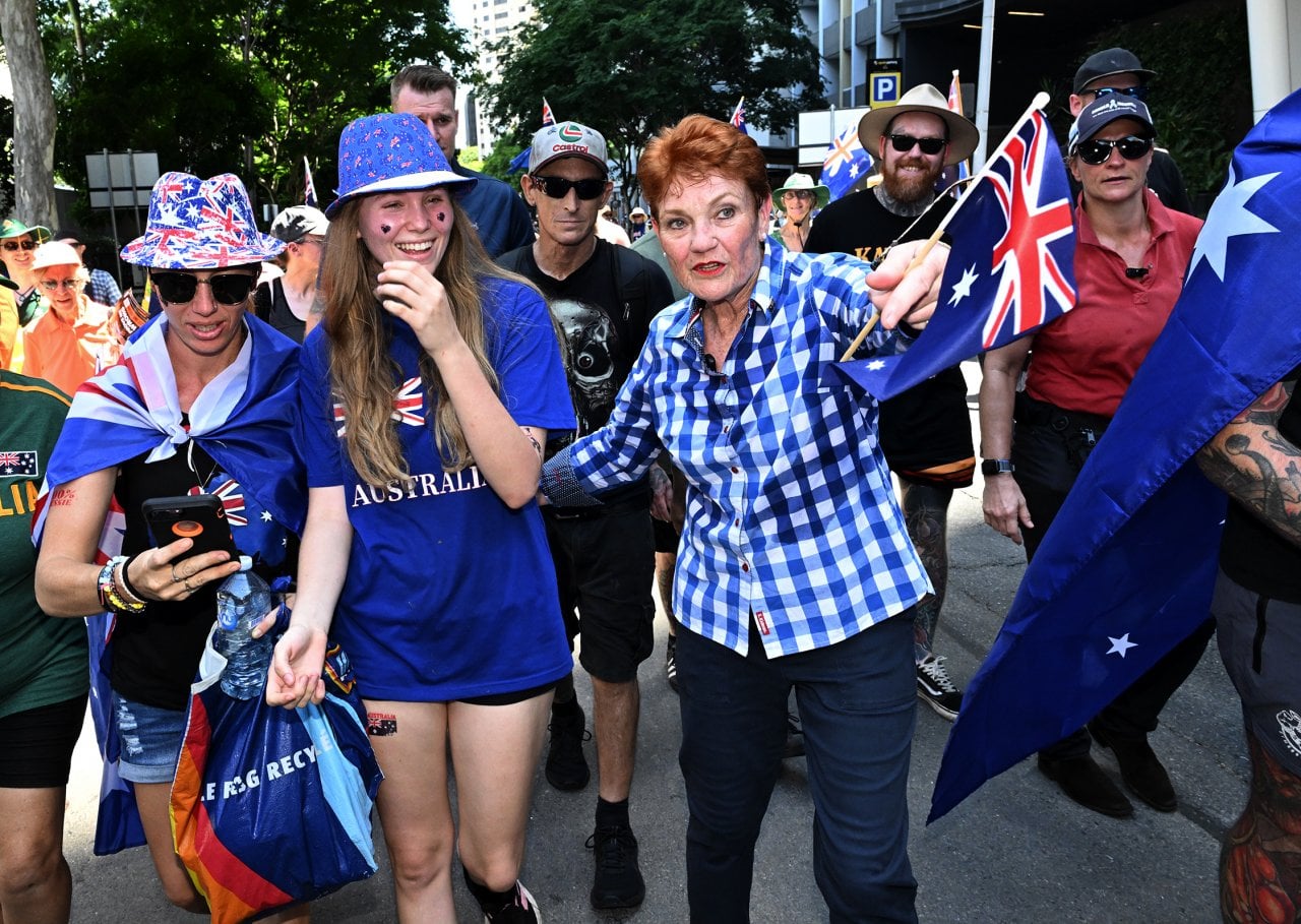 Pauline Hanson walks with protestors at a March for Australia rally.