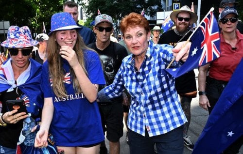 Pauline Hanson walks with protestors at a March for Australia rally.