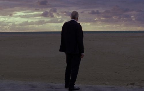 Stellan Skarskard on the beach in a scene from Sentimental Value.
